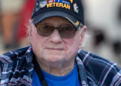 "Close-up of a Korean War veteran, showcasing a weathered but proud expression that reflects the deep experience and sacrifice of his service."