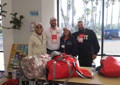 Honor Flight volunteers gathered at the airport, ready to assist veterans during their trip.
