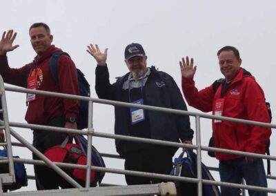 Veterans, guardians, and volunteers boarding the plane for their Honor Flight trip to Washington, D.C.